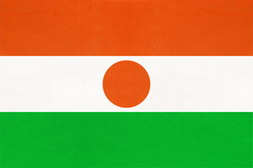 Republic Niger national fabric flag textile background. Symbol of world african country.