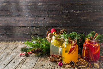 Autumn winter sangria, mulled wine or hot spiced cider cocktails. Red, white and orange hot winter...