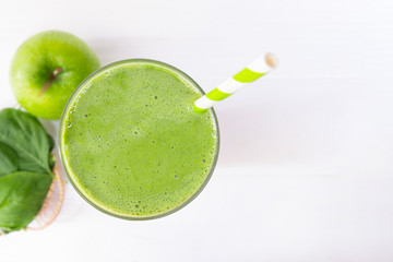 Spinach mix apple smoothie green juice beverage healthy the taste yummy in glass for on white wood background from the top view.