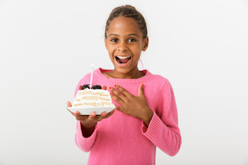 Image of delighted african american girl holding piece of torte