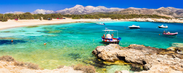 Beautiful wild  beaches of Naxos island. Scenery with fishing boats - obrazy, fototapety, plakaty