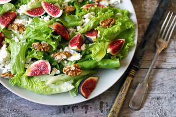Healthy salad with figs, cottage cheese and walnuts. Keto salad. Keto diet.