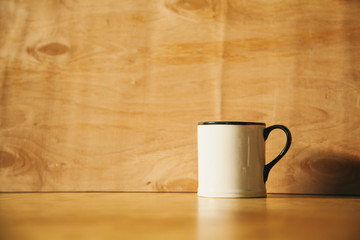 white cup on a wooden background. engineering background.
