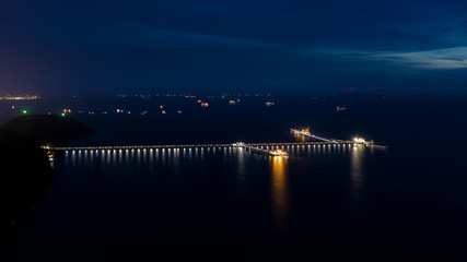 Fototapeta na wymiar twilight landscape blue sky and shipping oil storage bridge lighting boat background