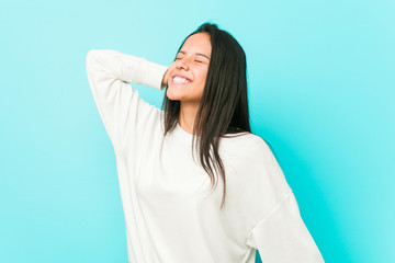 Young pretty hispanic woman dancing and having fun.