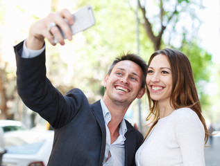 Man with girlfriend making selfie