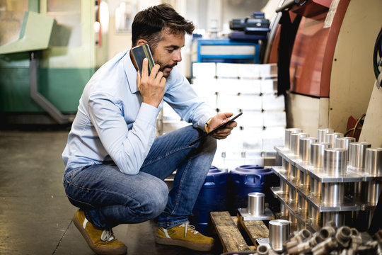 The engineer oversees the process of working in an electrical workshop,stock photo
