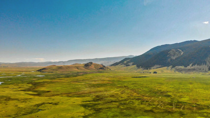 Naklejka premium Jackson Hole, Wyoming. Panoramic aerial view of town and landscape on a beautiful summer morning.