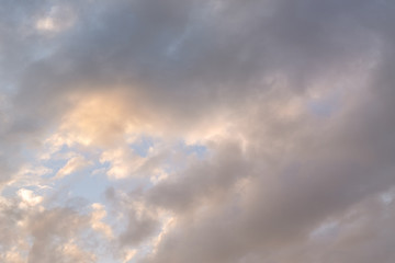 gray, gloomy and gloomy clouds in the sky, through them the rays of the sun