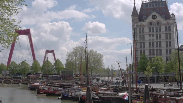 Rotterdam Cityscape of Oude Haven Old Harbour, historic ships in the dockyard, The Witte Huis or White House and Willemsbrug bridge traditional Dutch buildings on a sunny day in Rotterdam, South Holla