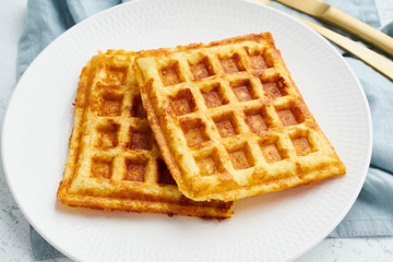 Chaffle, ketogenic diet health food. Homemade keto waffles with egg, mozzarella cheese. Gluten - free and carb-free. White background.