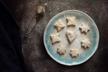 Homemade puff pastry cookies with icing sugar