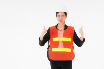 Asian young beautiful woman engineers wearing a black suit Orange reflective safety vest for working safety and white Safety helmet Standing and holding thumbs up as motivation at work concept isolate