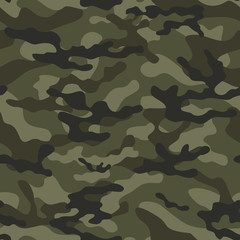Fototapeta premium Seamless vector camouflage pattern on a green background.