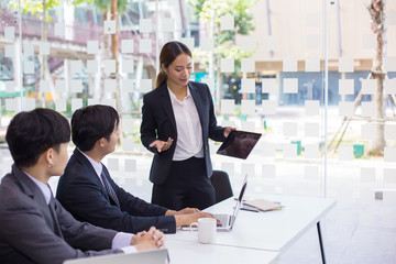 Start up concept,Start-up Asia business team in meeting and helped analyze the marketing problems of the company or beginning new project