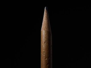 old wood pencil in the dark background