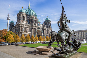 the famous berlin cathedral against a blue sky - obrazy, fototapety, plakaty