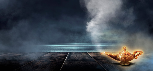 Dark night magic scene with golden lamp on a wooden tabletop. Night view, smoke, magic, magical...