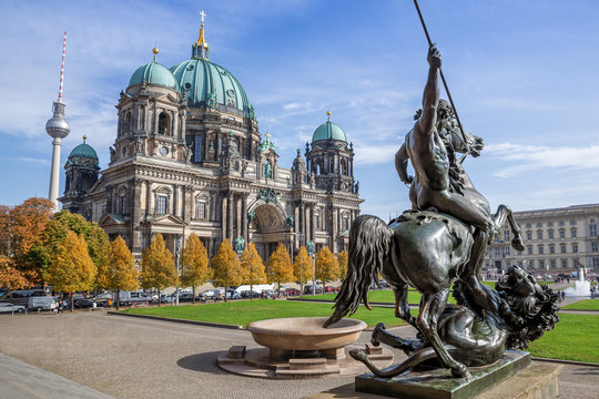 the famous berlin cathedral against a blue sky - Powered by Adobe