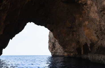 Fototapeta na wymiar Cave in coastal rock. Blue Grotto