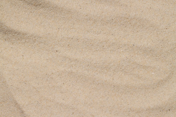 Fototapeta na wymiar Texture of sand on the beach in summer day