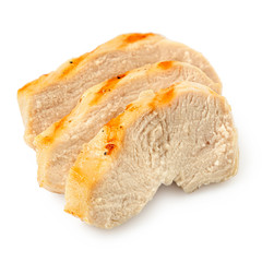 Three slices of grilled chicken breast with grill marks isolated on white.