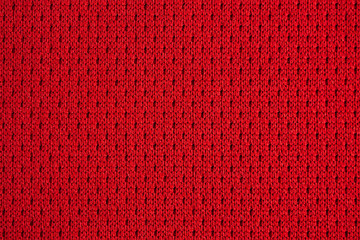 Red sports clothing fabric football jersey texture close up