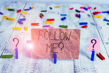 Text sign showing Follow Me Question. Business photo text go or come after demonstrating or thing proceeding ahead Scribbled and crumbling sheet with paper clips placed on the wooden table
