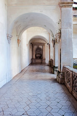Courtyard with colonnade inside the charterhouse of Padula, Salerno, Italy © Tony