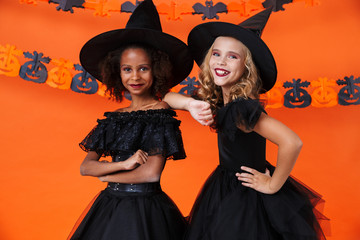 Obraz premium Image of cute multinational girls smiling and standing together