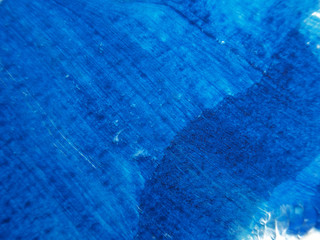 Blue and white acrylic painting texture on white paper background by using rorschach inkblot method.