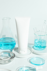 beauty spa medical skincare and cosmetic lotion bottle cream packaging product on white decor background with laboratory science test glass medicine