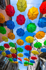 Fototapeta na wymiar 16 AUG 2019 - Gap, Hautes-Alpes, France - Colored umbrellas