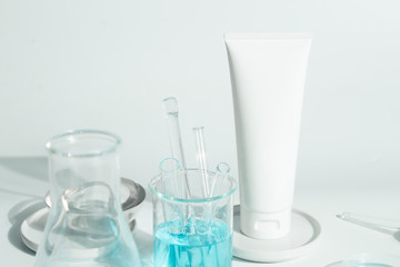 beauty spa medical skincare and cosmetic lotion bottle cream packaging product on white decor background with laboratory science test glass medicine