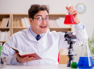 Mad crazy scientist doctor doing experiments in a laboratory