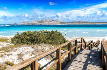Fototapeta na wymiar Stintino, La Pelosa beach, , is one of the most beautiful sandy beaches of the Mediterranean. Turquoise water. Sassari, Sardinia, Italy.