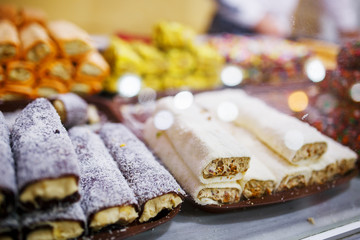 Eastern sweets, confectionery on the counter, Sherbet, Dzhezerye, halva, Turkish delight baklava.