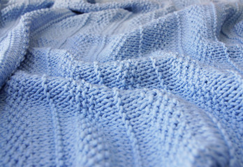 Knitted background. Knitted texture. A sample of knitting from wool