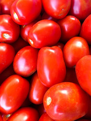 Background from red tomatoes. Ecological fresh tomatoes.