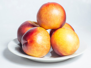 ripe peaches on a white background. 