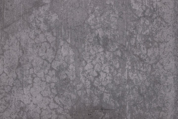 Gray concrete wall with cracks. Cracked industrial wall as background.