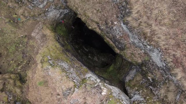 Sumgan-Kutuk karst cave. Descent cavers in the cave. Aerial view.