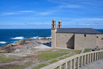 Fototapeta na wymiar Catholic Sanctuary in Muxia Coast, Galicia, Northern Spain. This is one of the last stages in the Camino de Santiago along with the visit to the cape of the Finisterre. 