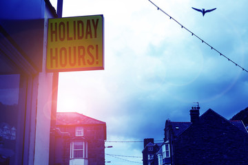 Writing note showing Holiday Hours. Business concept for Overtime work on for employees under...