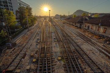 Train rails during sunset in the city