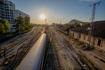 Train rails during sunset in the city