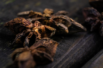 Macro photography of star anise on rustic wood