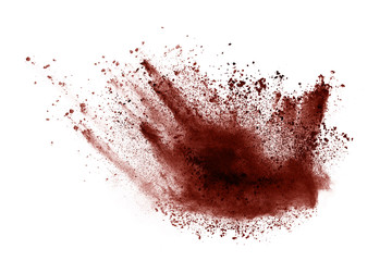 Brown color powder explosion on white background. Colored cloud. Colorful dust explode. Paint Holi.