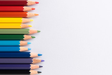Colored pencils on white paper background