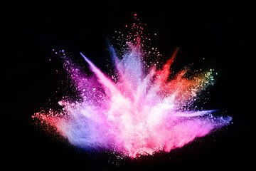 abstract colored dust explosion on a black background.abstract powder splatted background,Freeze...